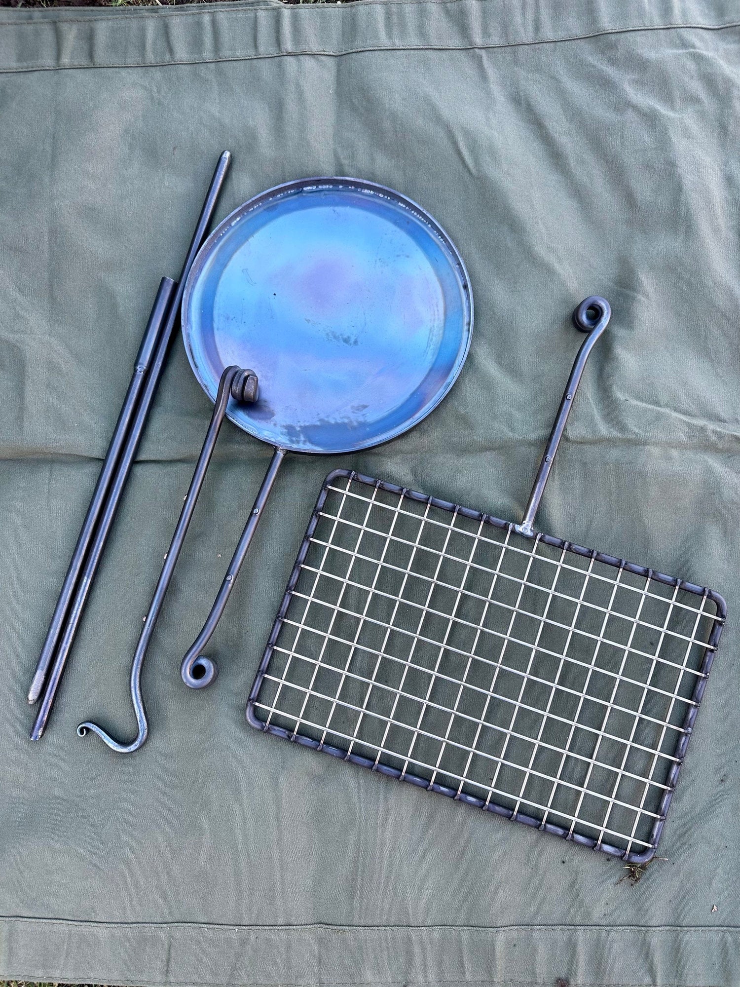 fire anchor cook swing arm. Is a portable bbq cooking setup.