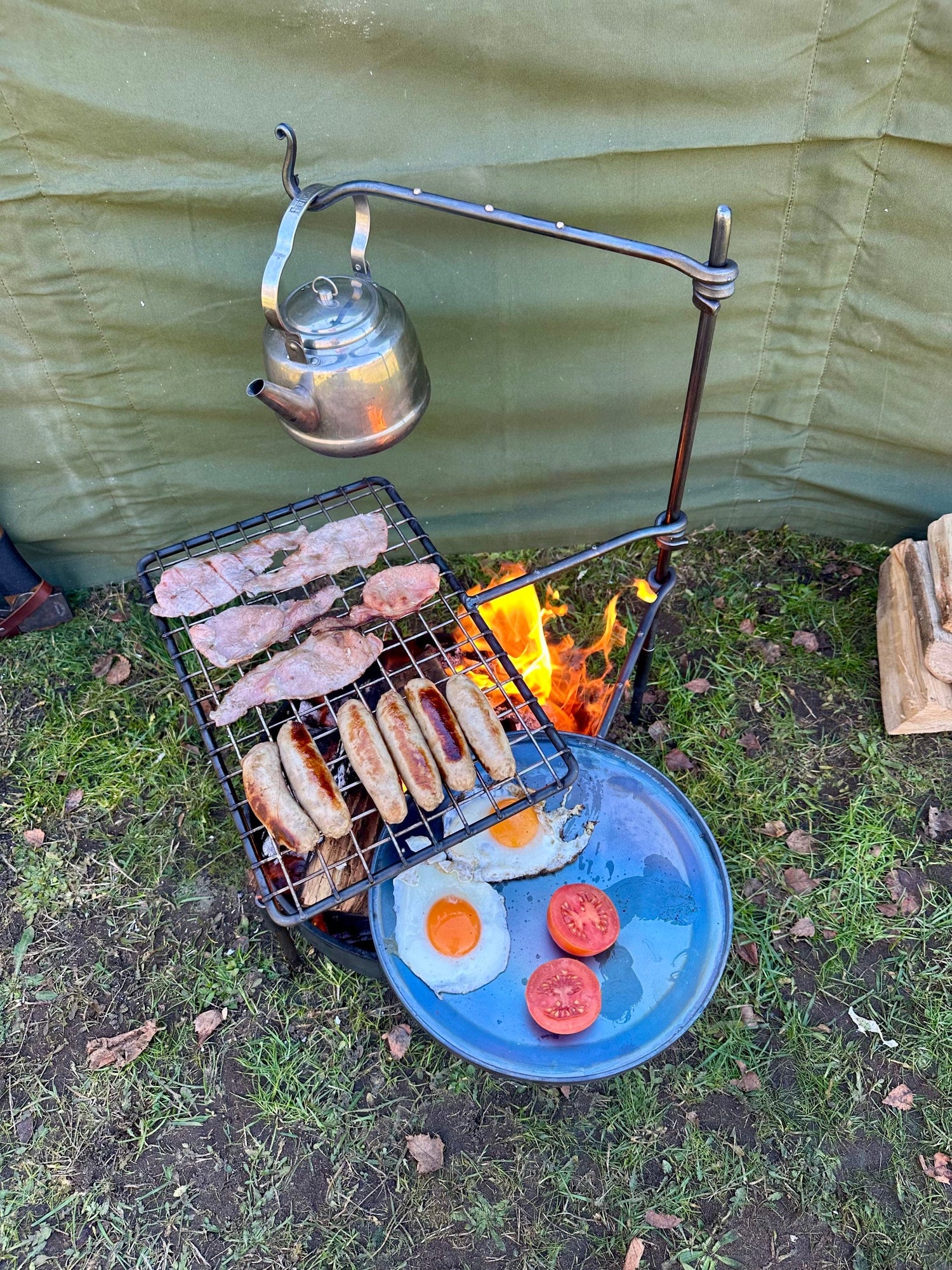 fire anchor cook swing arm. Is a portable bbq cooking setup.
