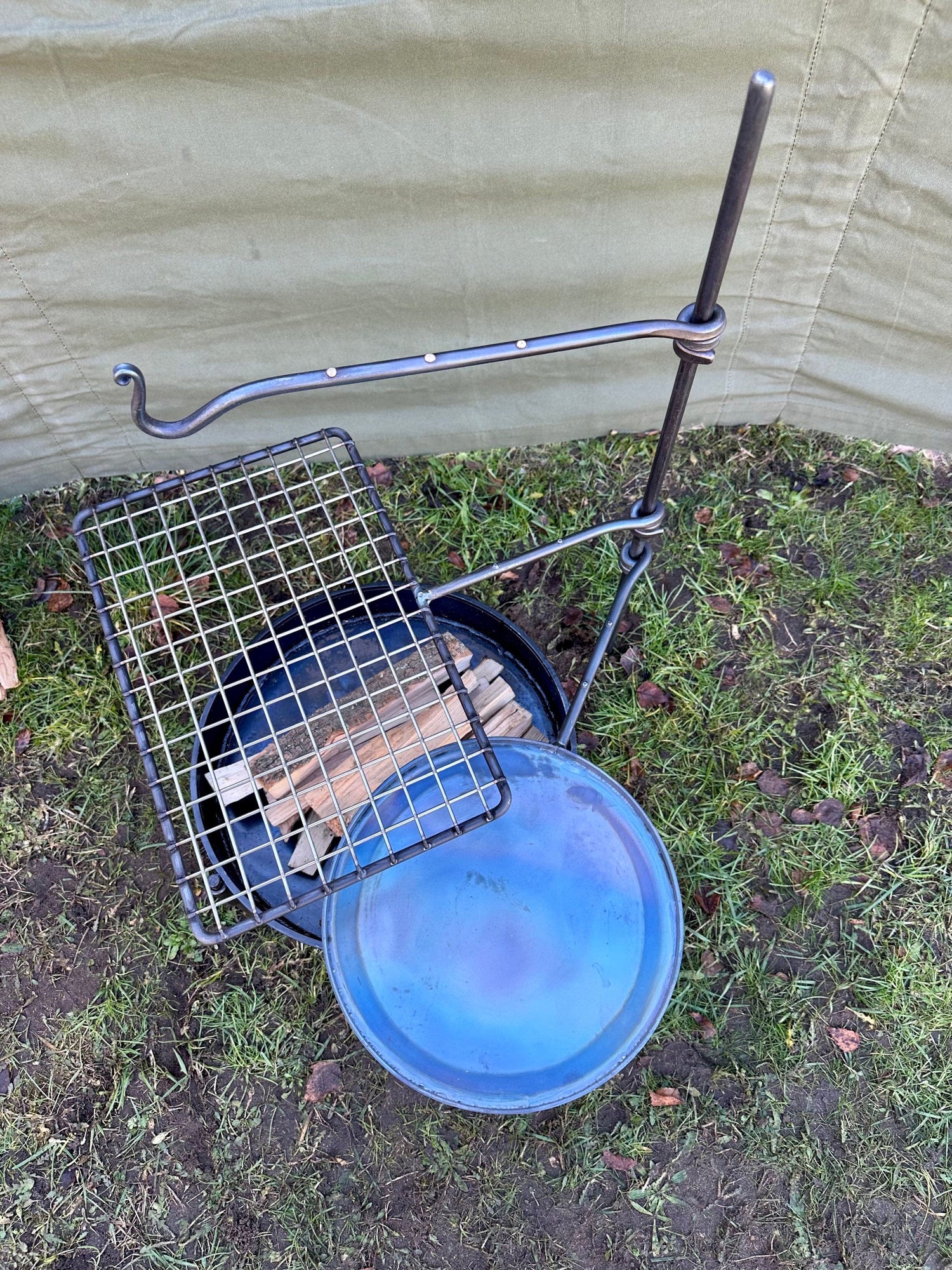 fire anchor cook swing arm. Is a portable bbq cooking setup.