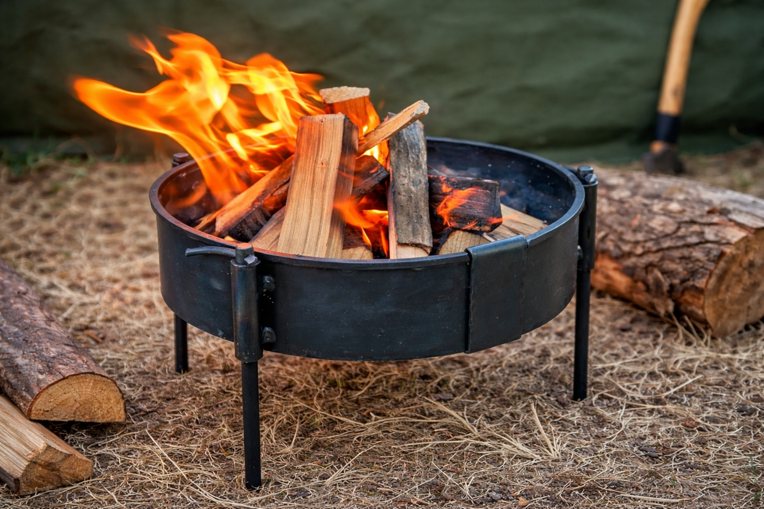 Outdoor fire pit with burning logs on ground in garden setting