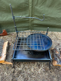 Portable stove with grill on a camping ground