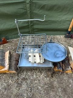 Metal cooking basket with lid on a wooden surface