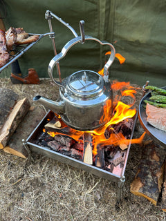 Tea kettle over a campfire
